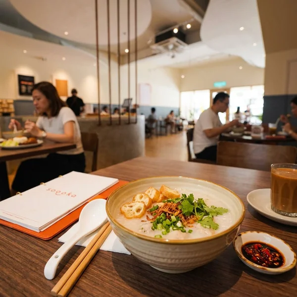 Handmade fish ball porridge with crispy cakoi coins